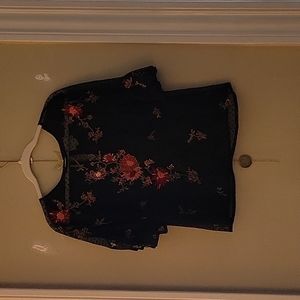 Black knit top with impeccable floral detail